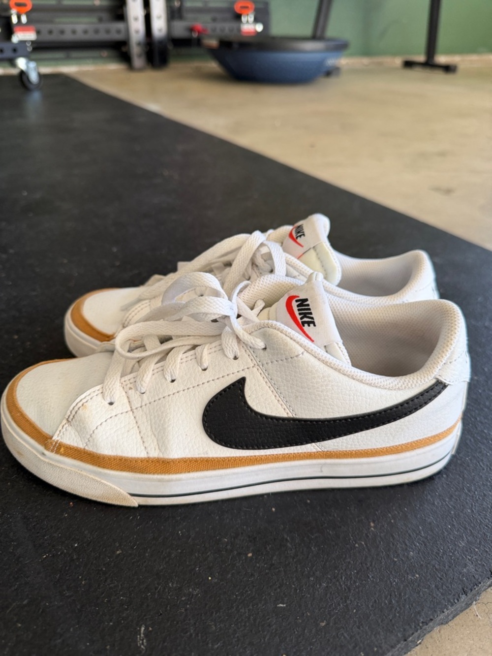 Nike White Sneakers with Black Swoosh and Tan Stripe